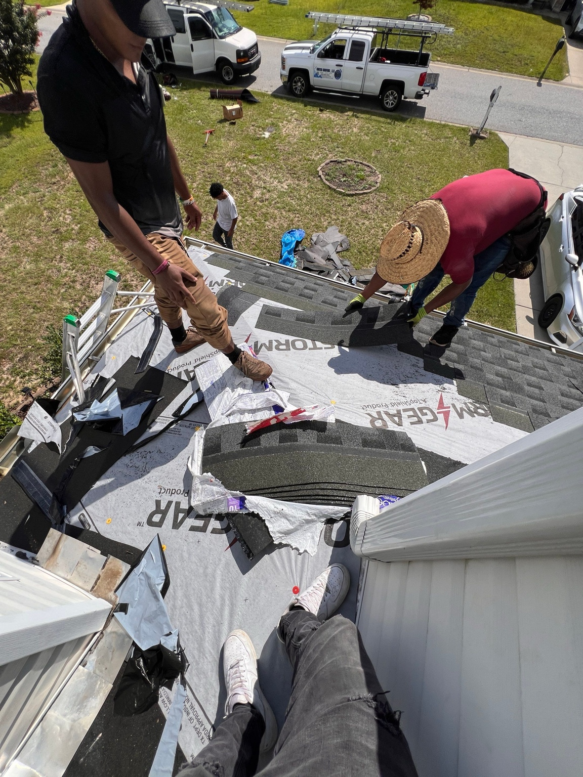 Roof shingle replacement in progress